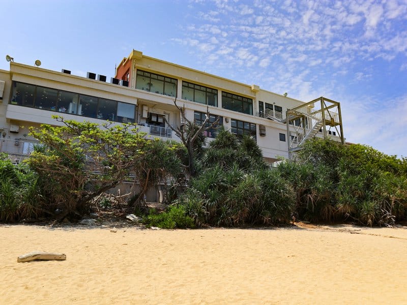 View of shop building from beach